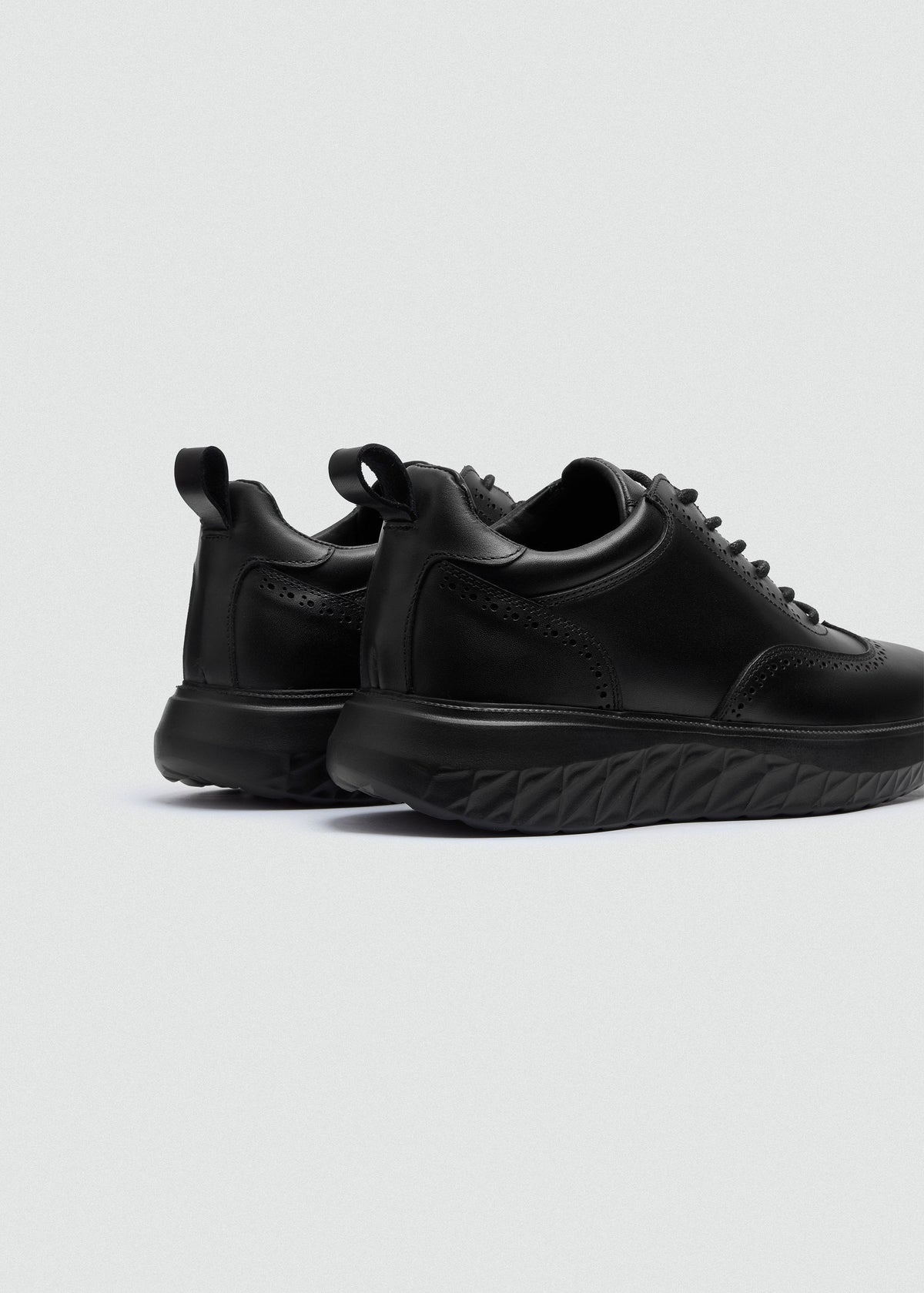 Wingtip Leather Sneaker — Black